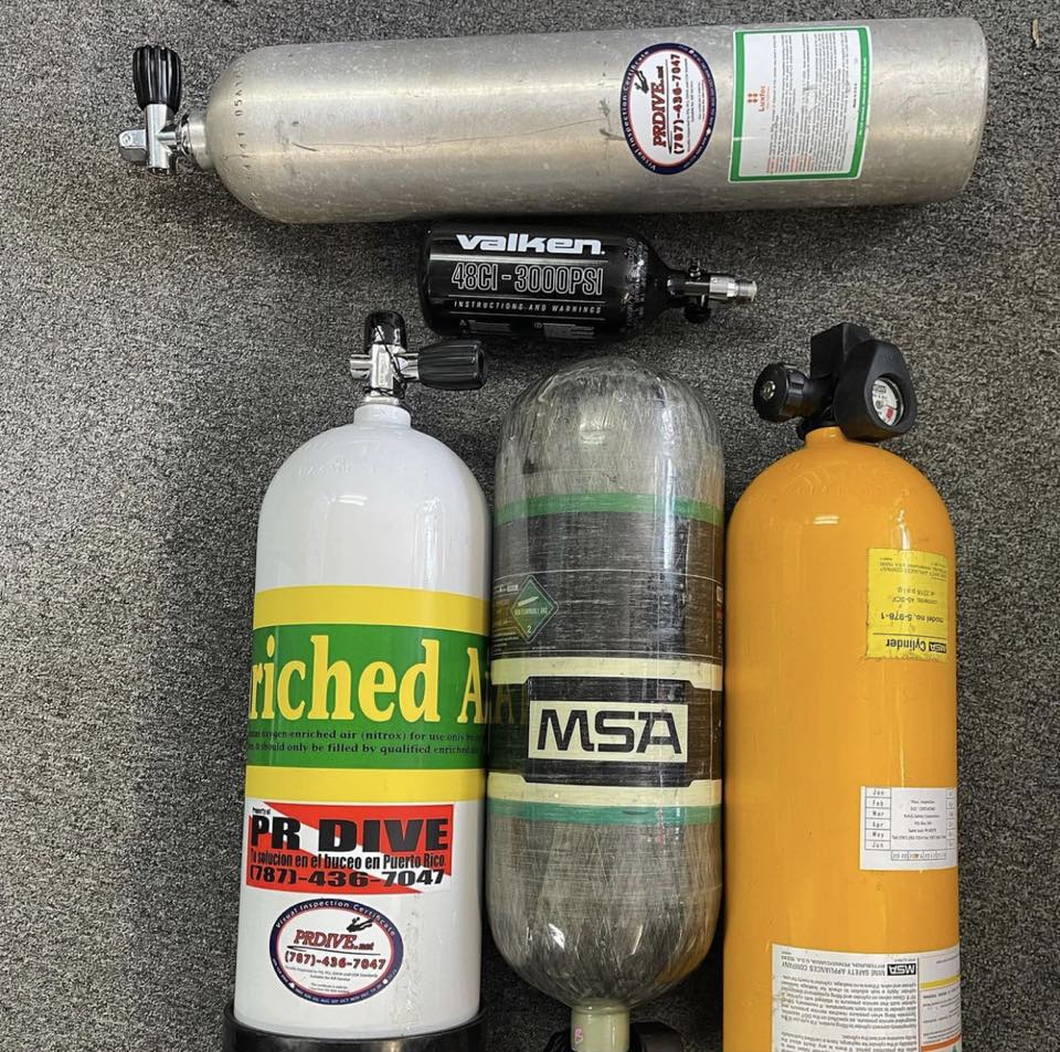 Scuba cylinders lined up at the shop