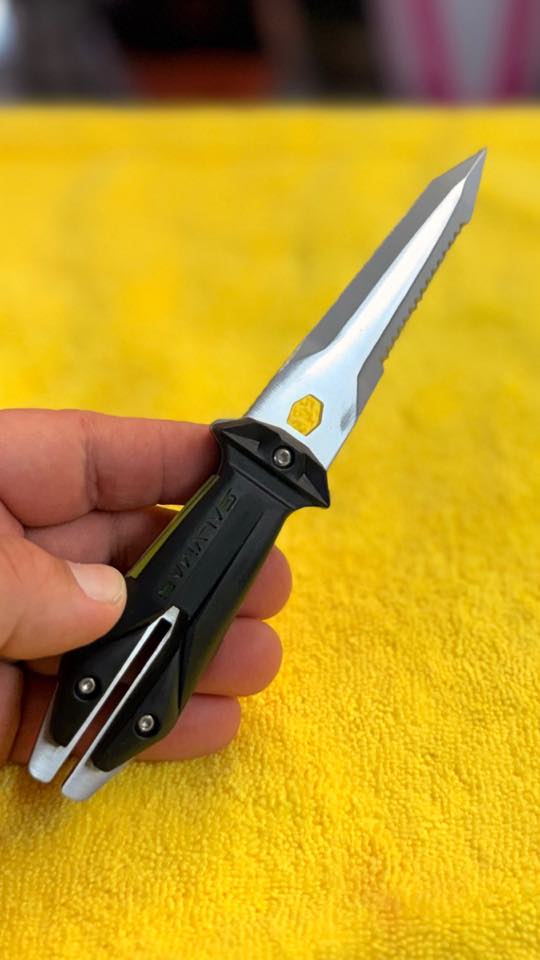 A dive knife held in hand