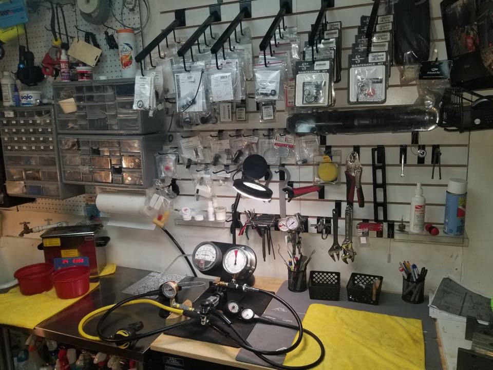 The PR Dive service bench with parts drawers, tools and test gauges